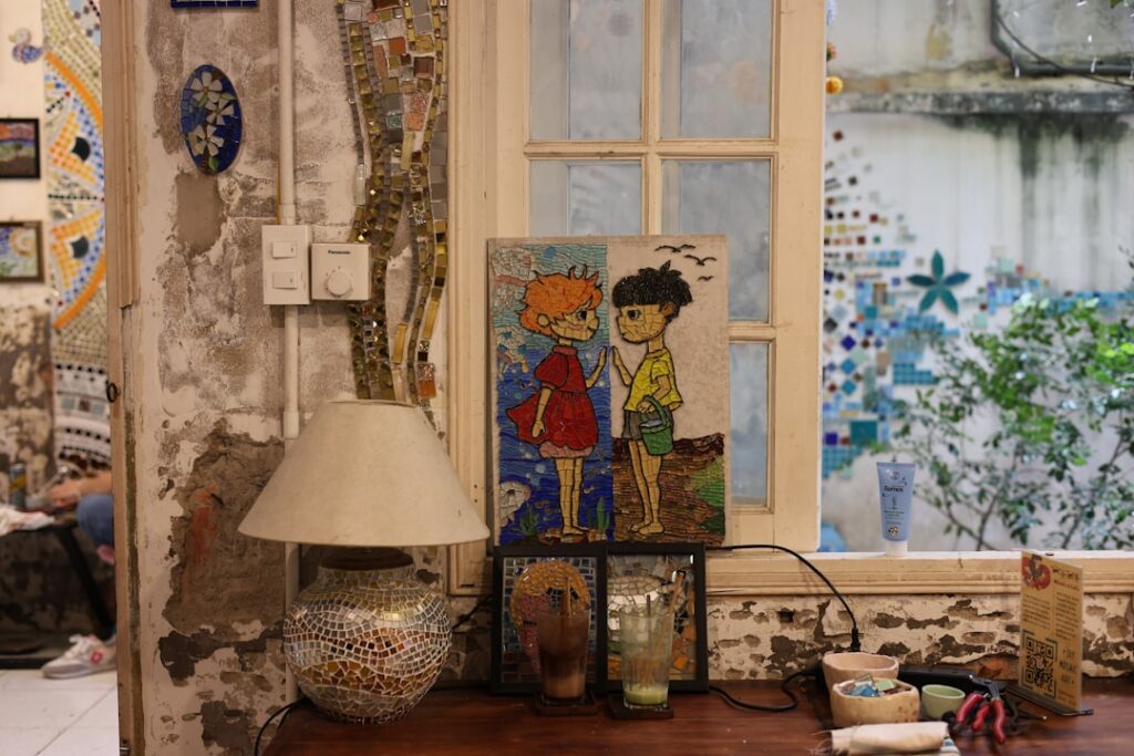 Mosaic artisans at work in a bright studio