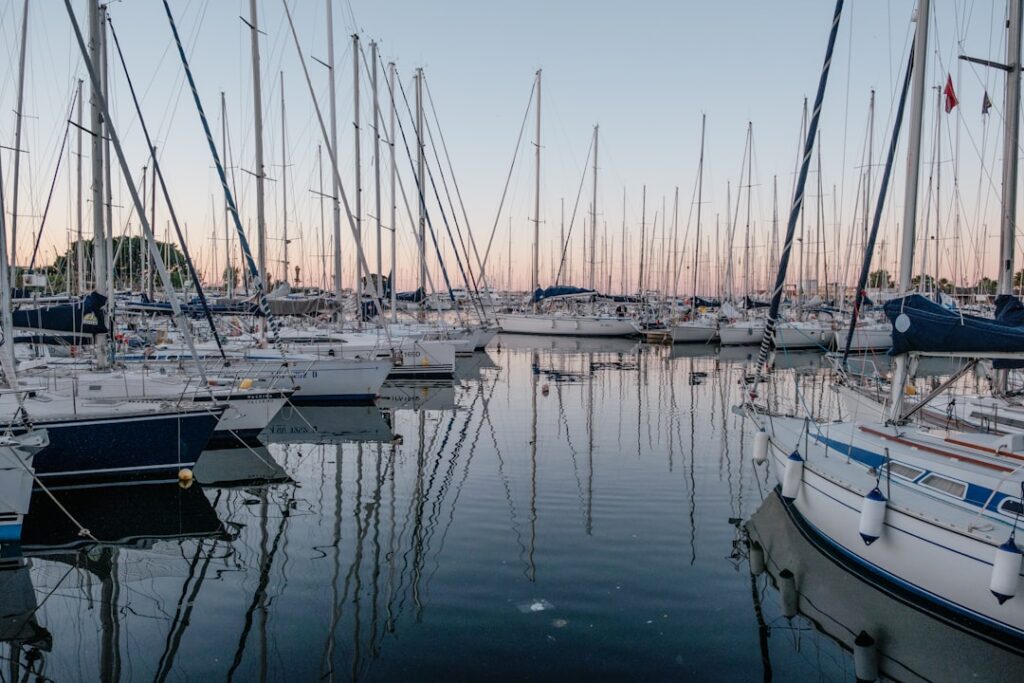 Boats in Palermo harbor with sunset reflections