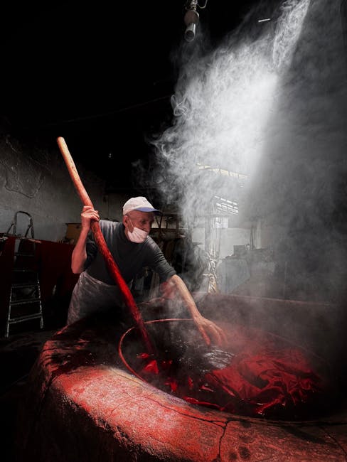 hand dyeing wool in traditional dye workshop at Telai del Sasso