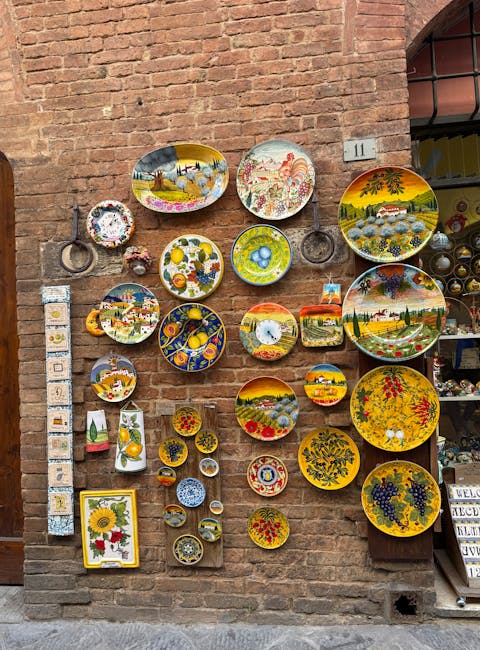 Colorful hand-painted ceramic plates displayed on a brick shop wall