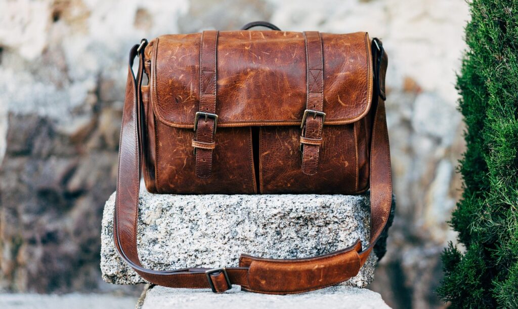 handcrafted leather bag leaving artisan shop in Matera Sassi