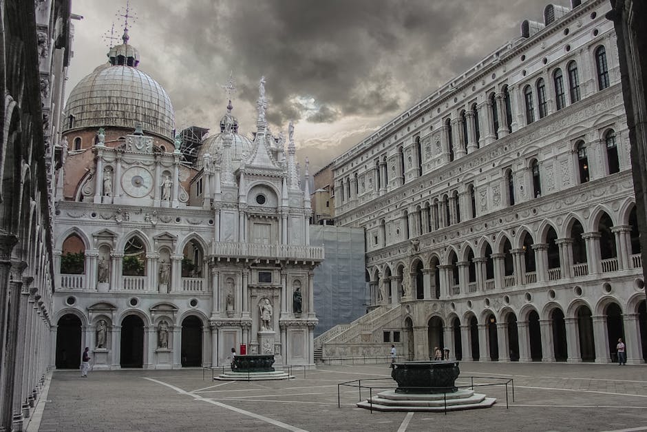 Quiet courtyard of the Doge's Palace in Venice with stone wells