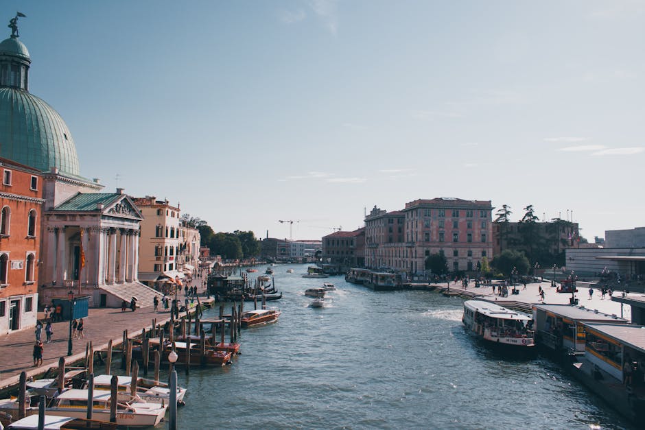 Boats and vaporettos on Venice Grand Canal by domed church