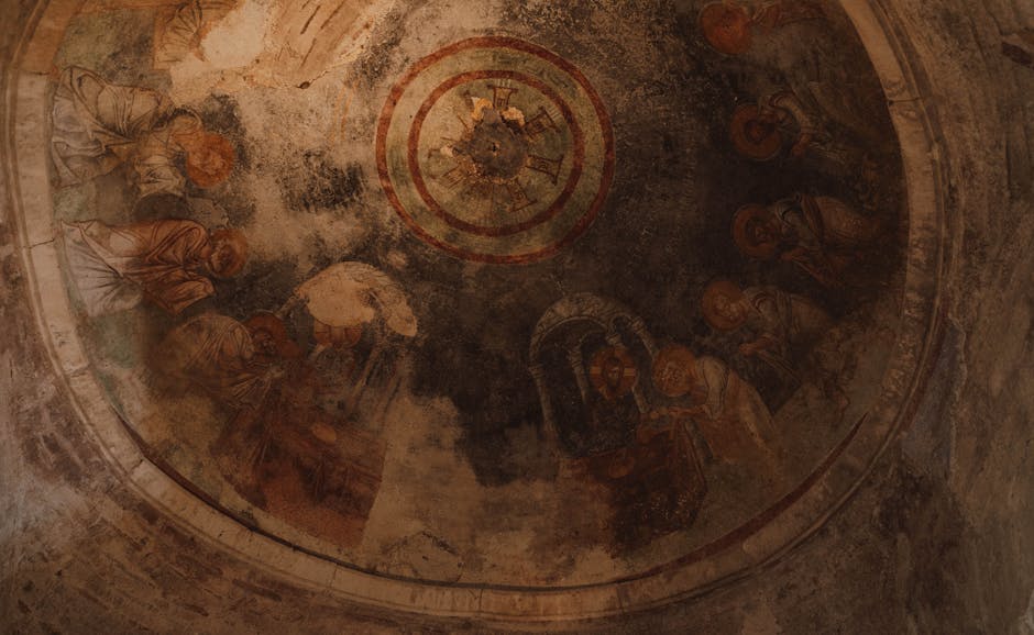 Darkened circular fresco ceiling showing faint religious figures and wear