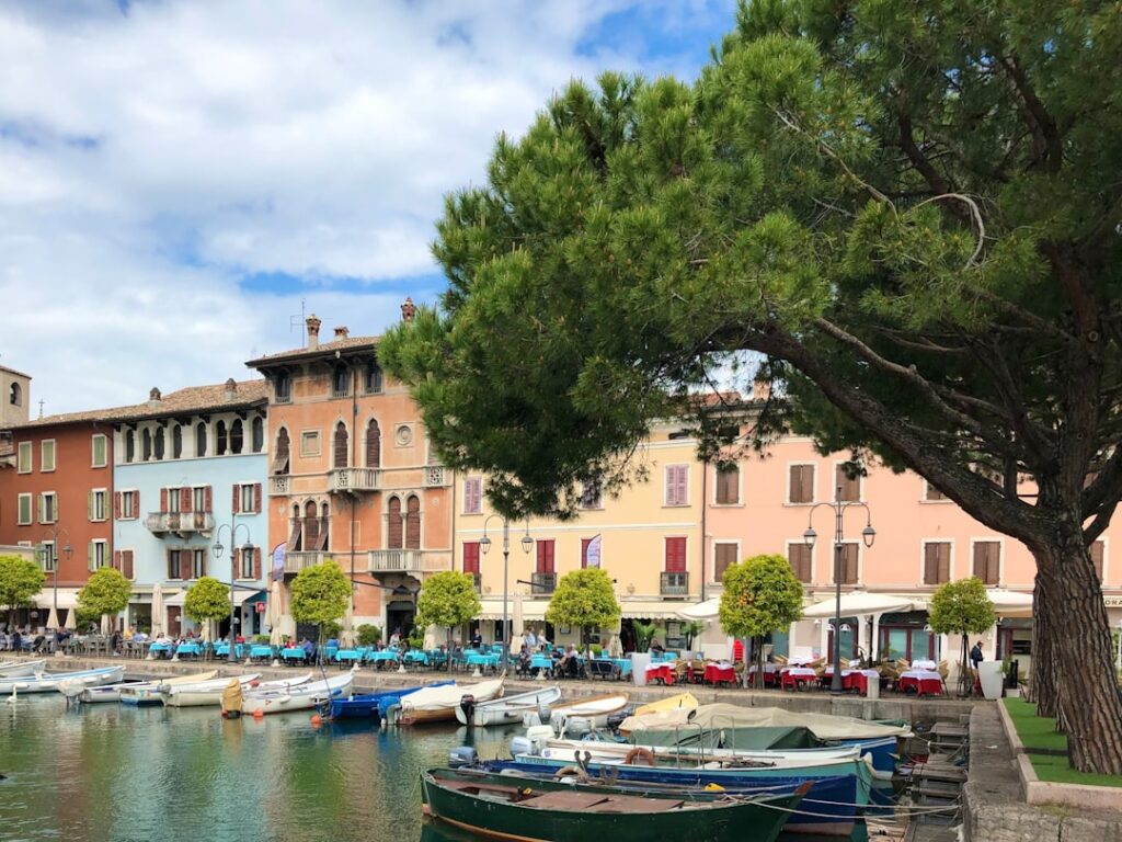 Boat departing Desenzano harbor morning