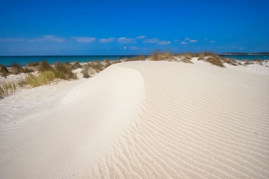 Is Arenas Biancas white sand dunes leading to deep blue sea at Porto Pino