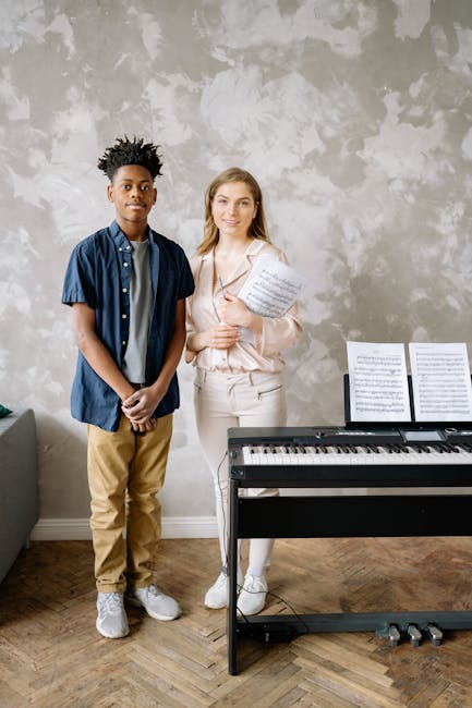 Young student and teacher beside electric keyboard during Parma music workshop