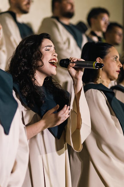 Female choir soloist singing into microphone during Parma concert
