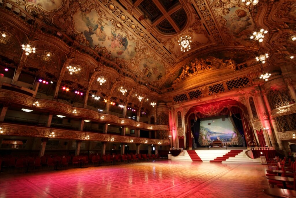 Lavish gilded auditorium and stage with painted ceiling in Parma