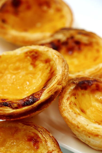 Child tasting pastel de nata pastry closeup