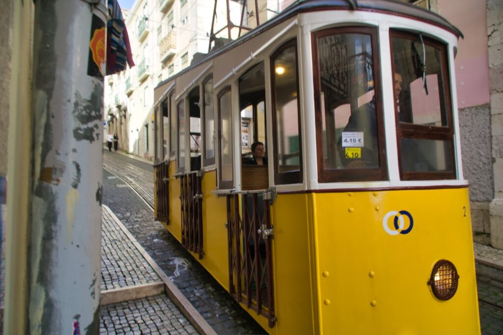 Tram 28 uphill narrow street historic