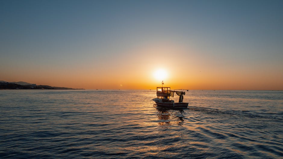 Barcola promenade with fishermen and boats in the morning