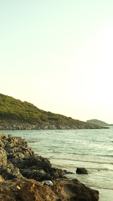 Barcola swimmers rocky shoreline evening