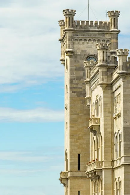 Close-up of Miramare Castle's crenellated tower against blue sky, Trieste