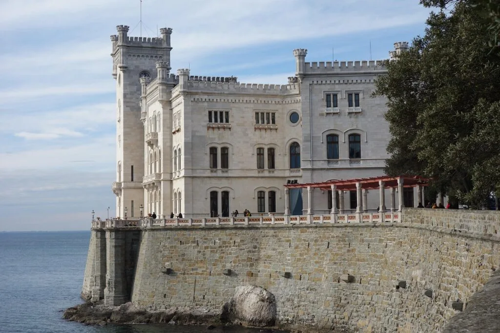 Miramare Castle perched on rocky seawall near Trieste shore