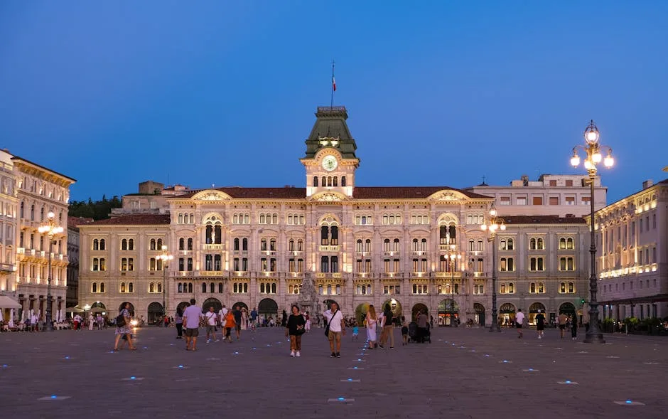 Piazza Unità in Trieste at dusk with illuminated town hall