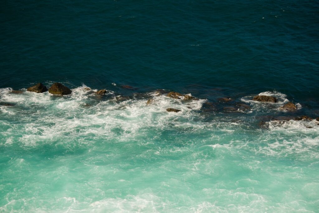 Rocky shoreline and turquoise water at Filicudi