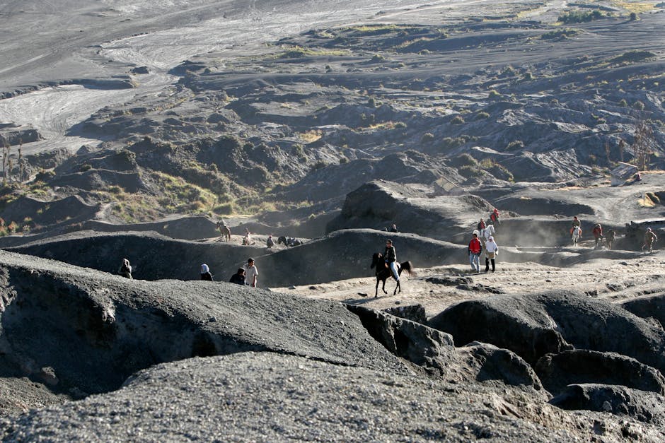 Hikers and a horse traversing the Sciara del Fuoco on Îles Éoliennes