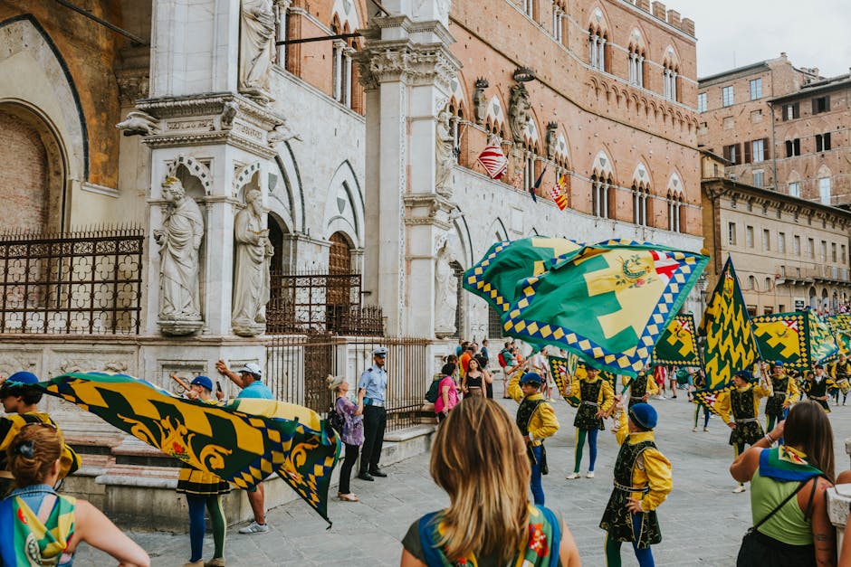 Flag-waving performers in colorful yellow-green costumes during Ravenna carnival parade