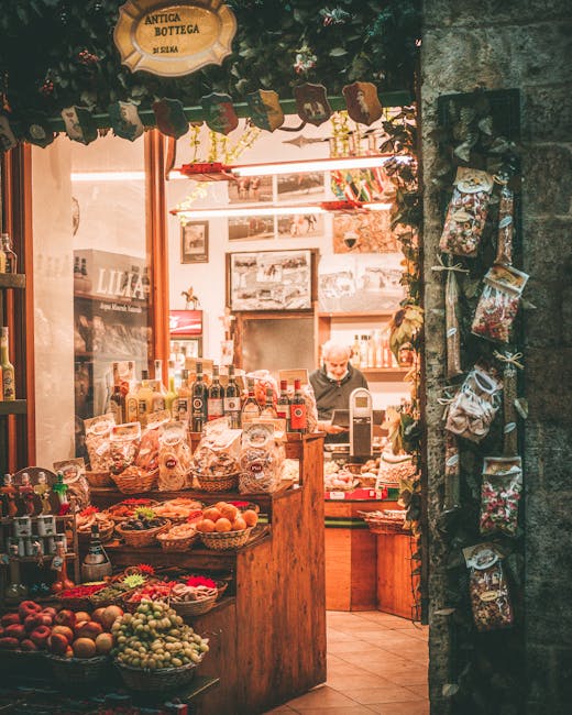 Rustic Modena shop doorway displaying fruit, bottles, and hanging goods