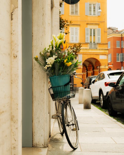 Bicycle with a basket of tulips parked on a Modena street