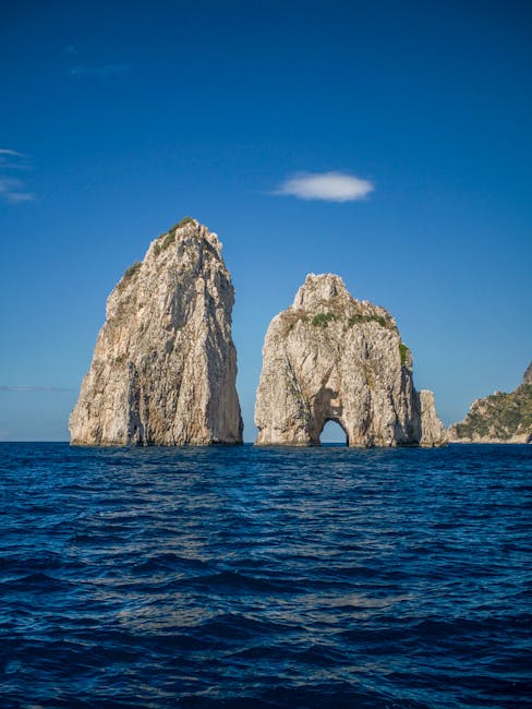 Sunrise over the Faraglioni rock formations