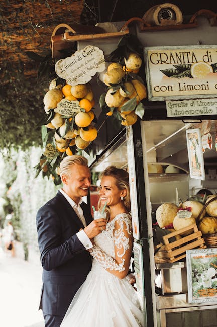 Smiling couple tasting drinks at a lemon stand in Capri