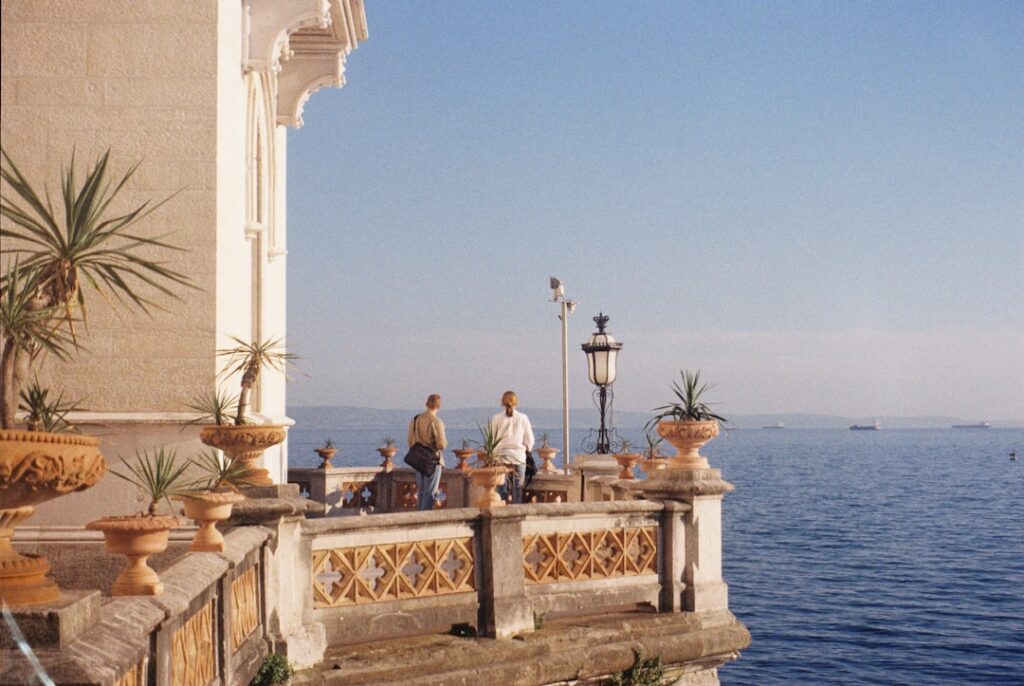 Ornate terrace overlooking the sea in Capri with two people