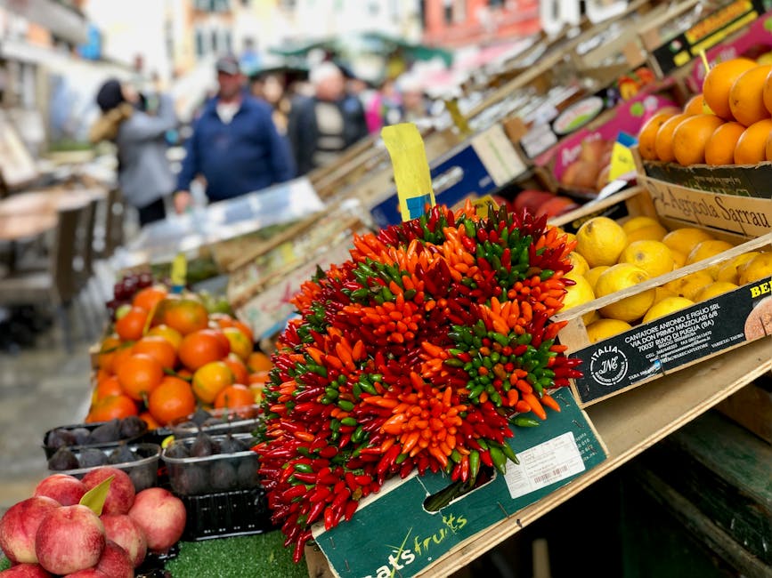 Vibrant chili pepper bunch and citrus displayed at Capri market stall