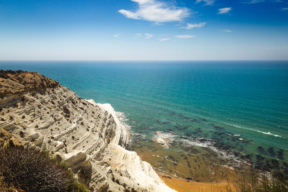 Aerial view of dramatic white Scala dei Turchi cliffs and turquoise sea, Sicily