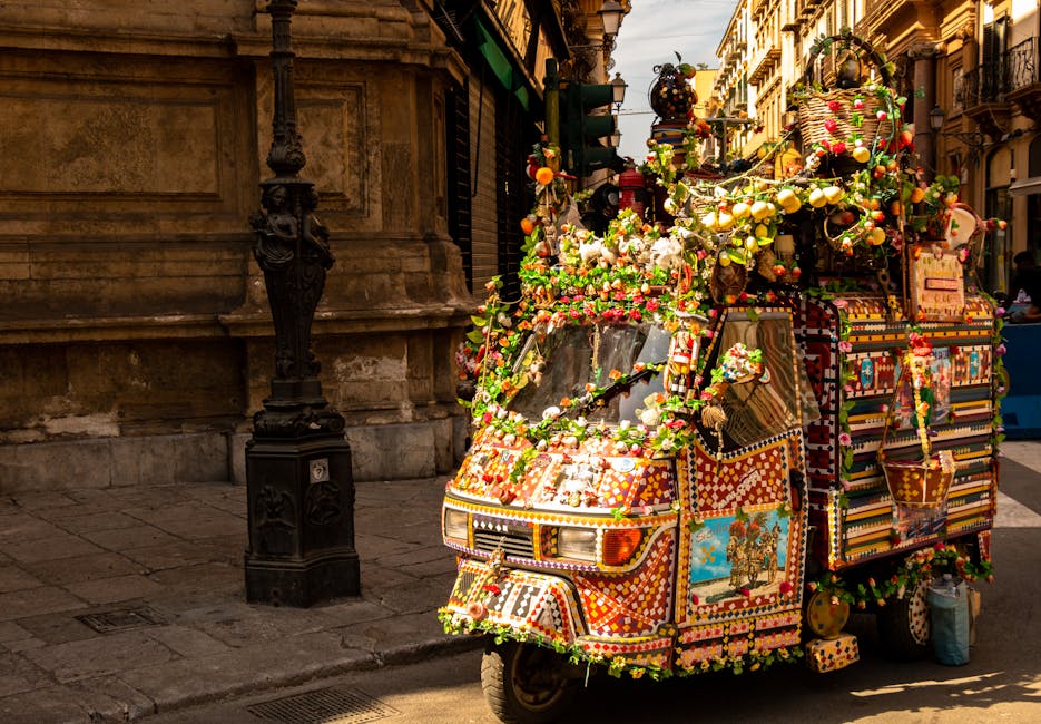 Tiny Sicilian three-wheeler covered in hand-made colorful festival decorations