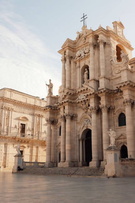 Baroque façade with statues and columns at Syracuse Cathedral, Sicily