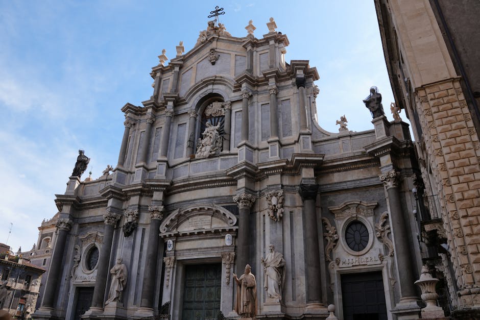 Baroque cathedral façade in Catania, Sicily under blue sky