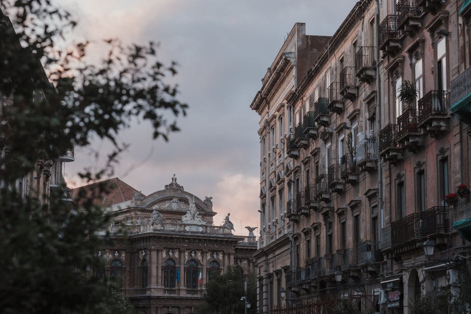 Palermo street with Teatro Massimo facade and balcony-lined buildings