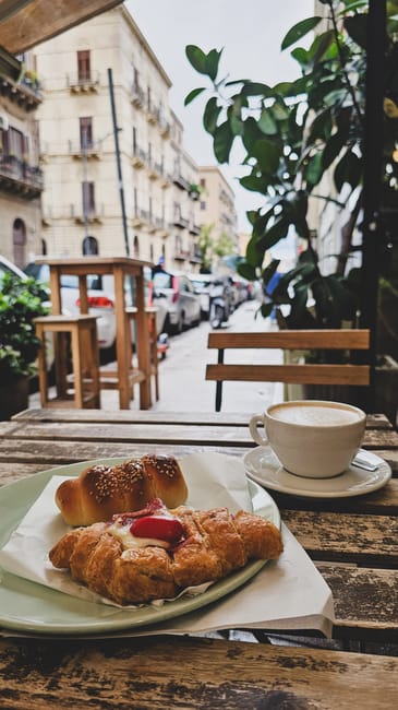 Small street cafe with outdoor tables in Palermo