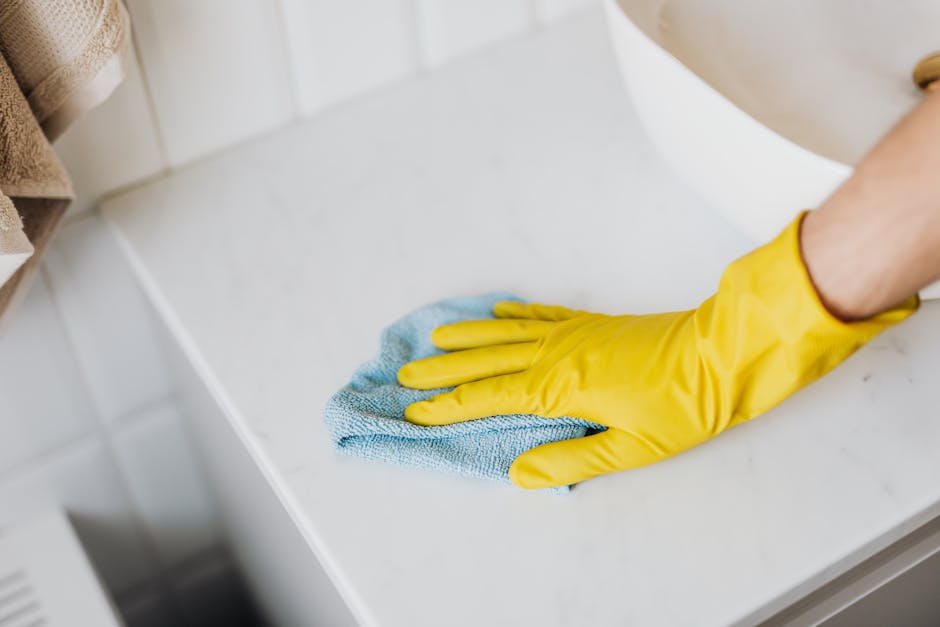 Conservator cleaning marble statue