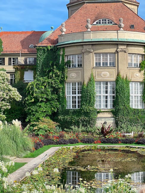 Orangery and lily pond framed by ivy-covered façade in Lac Majeur gardens
