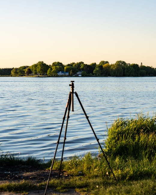 Tripod silhouette on the Lake Maggiore shore at golden hour