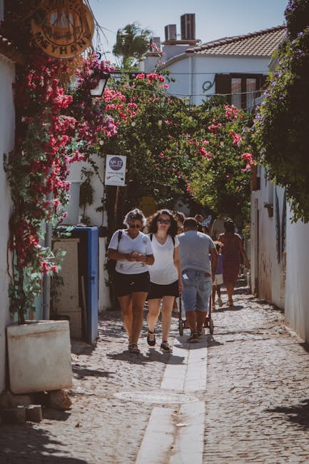 Tourists strolling through a historic villa garden