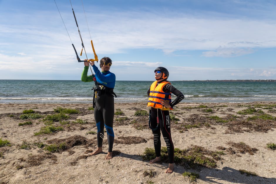 Instructeur montrant la barre à élève sur la plage du Lac Majeur