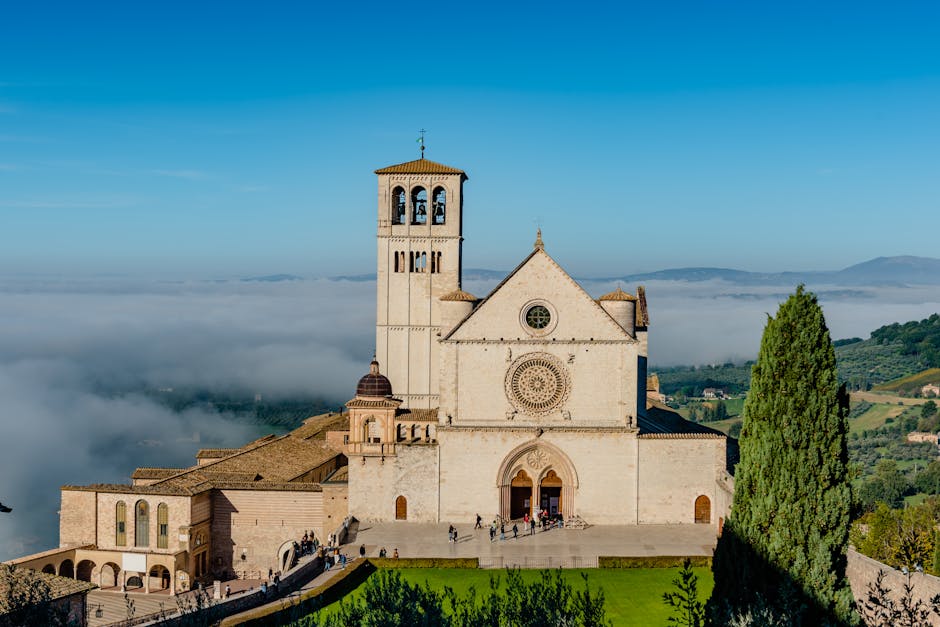 Basilica of Saint Francis in Assisi, Umbria, above morning fog