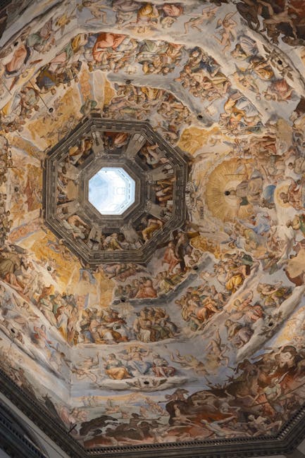 Ornate frescoed octagonal dome with central oculus in Assisi