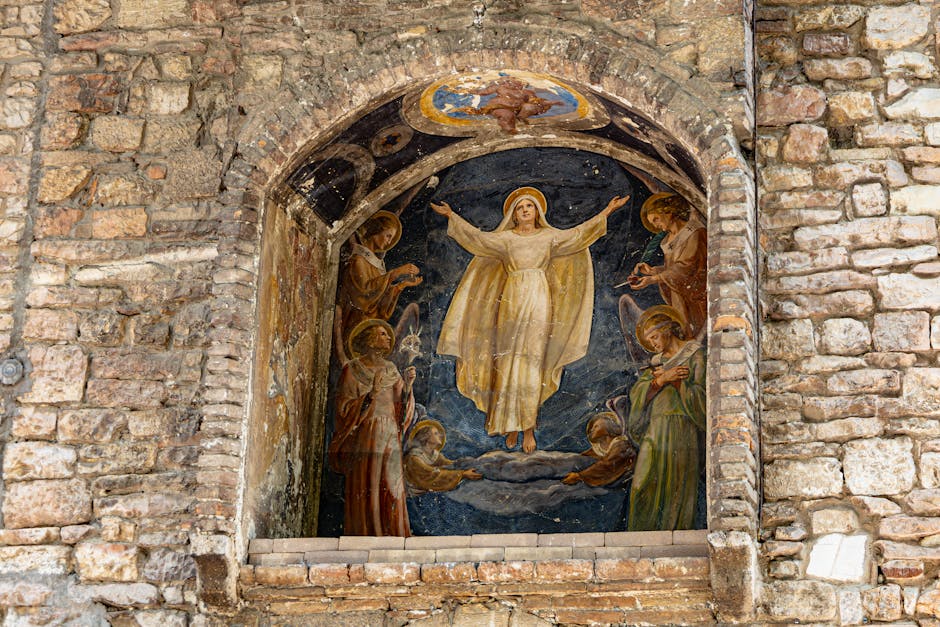 Stone niche fresco showing the Virgin's ascension above Assisi walls