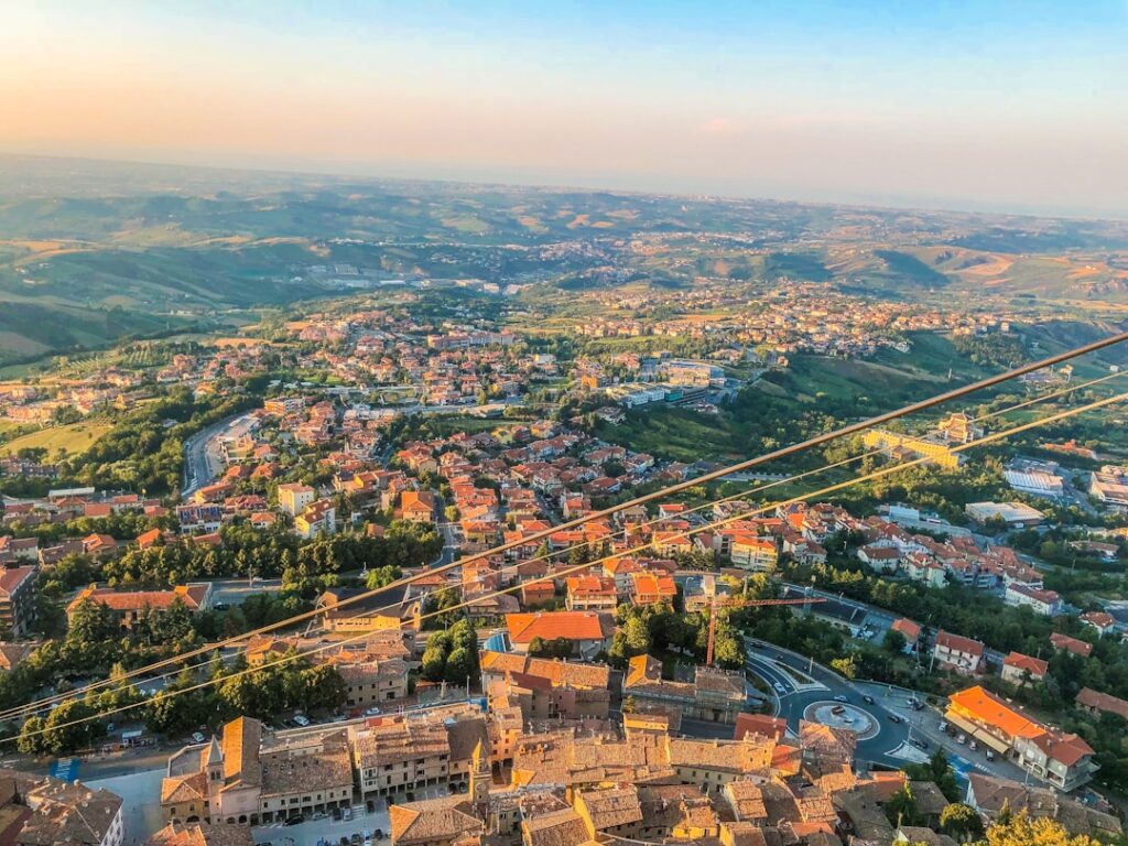 Aerial view over Umbria hill town with rooftops and cable wires