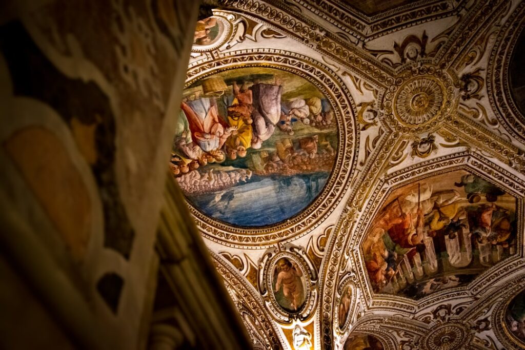 Ornate frescoed dome and gilded stucco on an Assisi church ceiling