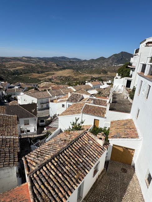 Panoramic view of white-roofed houses and rolling valleys in Calabria