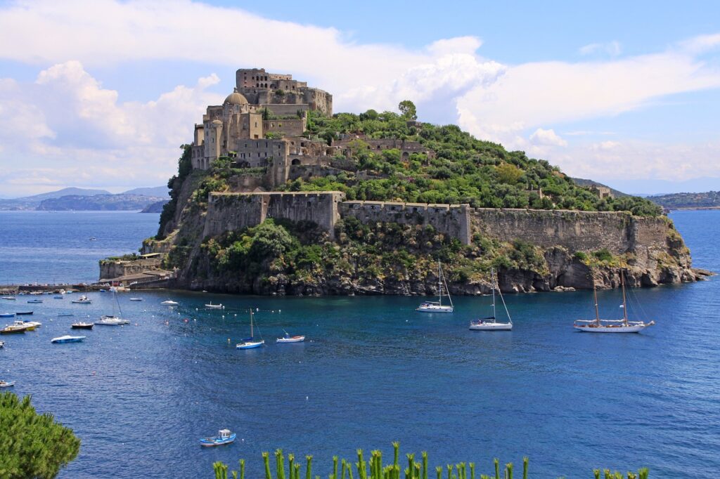 castello aragonese on small island with medieval fortress and sea