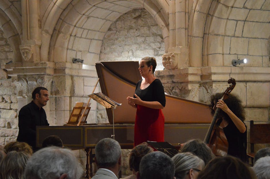 Vocalist and ensemble performing in Trento's vaulted stone chamber.