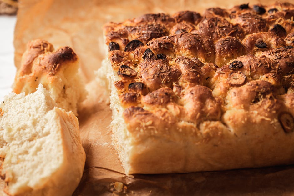 Close-up of the open crumb of sourdough focaccia in a Bari bakery