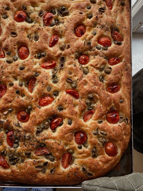 Close-up of olive oil being drizzled on sourdough focaccia in Bari